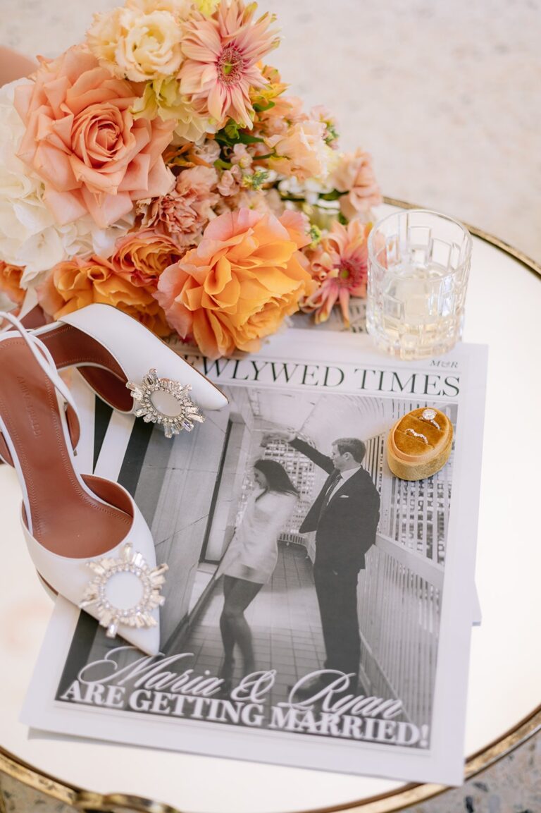 Bridal bouquet and a personalised wedding newspaper on a plate, Italian Wedding