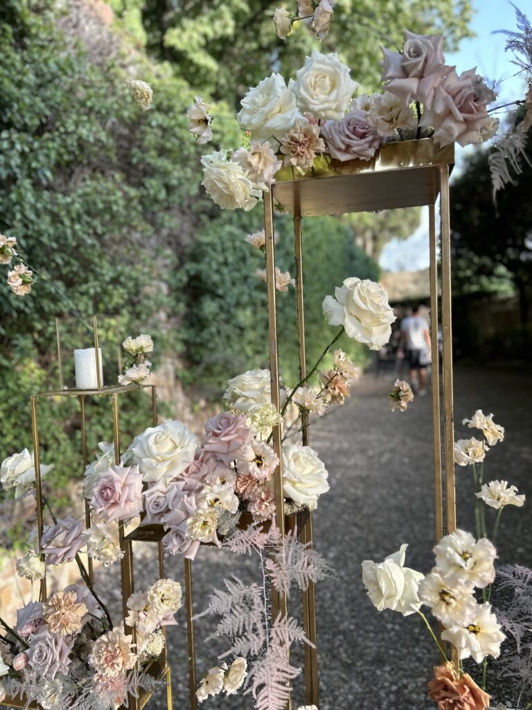 Gilded floral ceremony arch with soft lilac and cream flowers, Italian Wedding