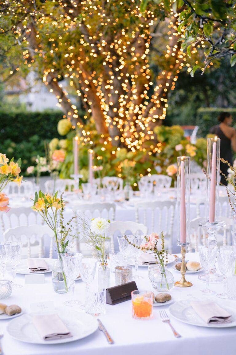 Reception tables beneath a tree hung with lights, Lake Como, Italian Wedding
