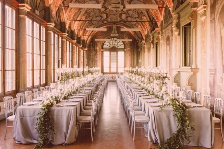 Long frescoed gallery laid for a wedding banquet, Italian Wedding