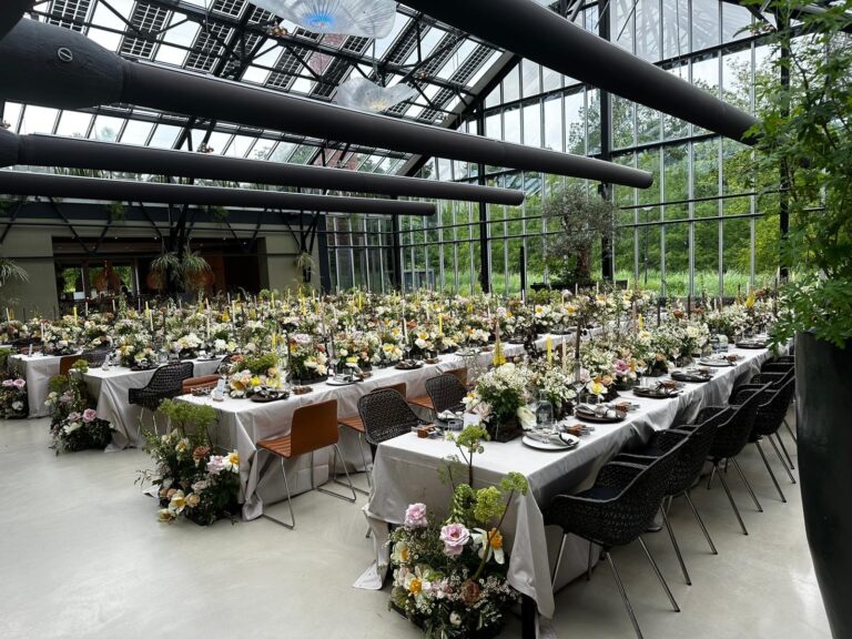 A wide view of the glasshouse reception beneath its steel-framed roof, Jamie Aston