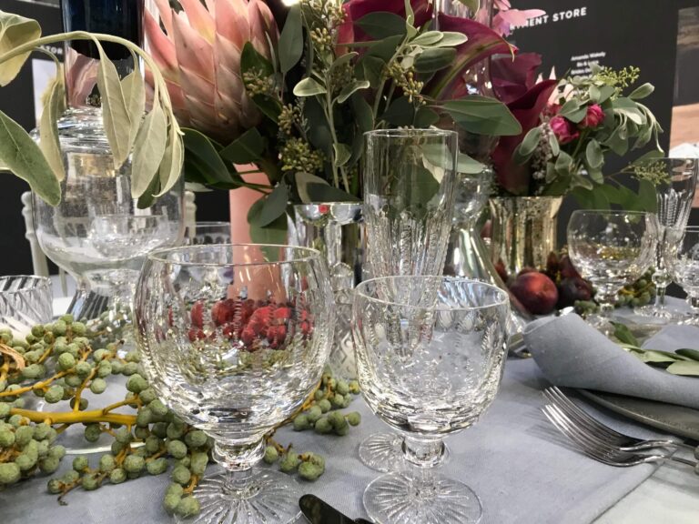 A tablescape detail in protea, rose and eucalyptus, with crystal glassware, Jamie Aston