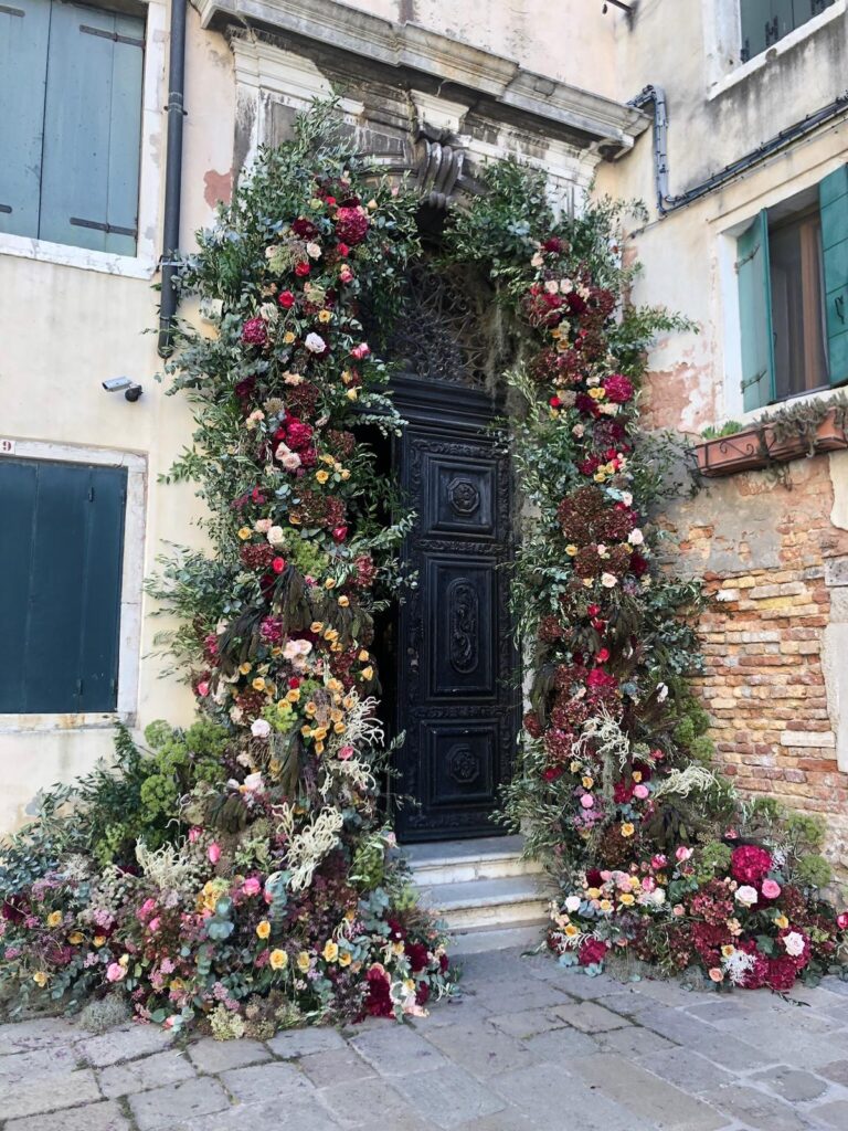 A floral doorway installation in Venice, Italy, Jamie Aston