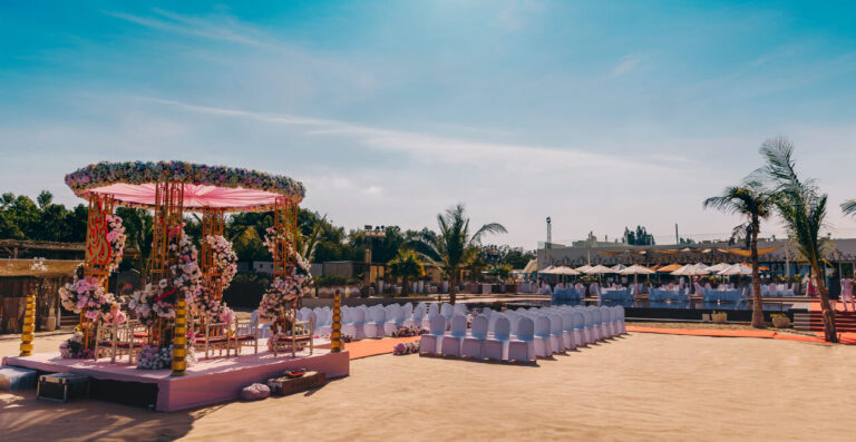 A floral mandap set up on the sand at Soul Beach, Jebel Ali Golf Resort