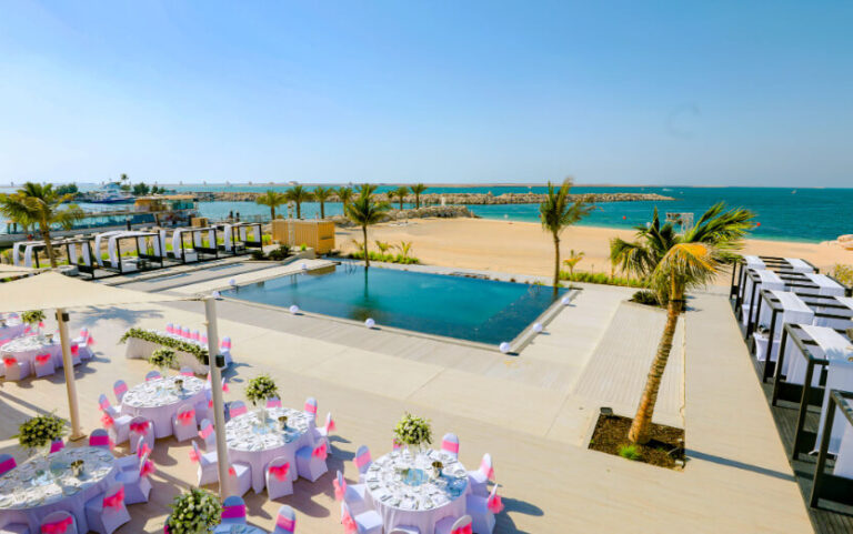 Pool terrace and beach at Soul Beach laid for a reception, Jebel Ali Golf Resort