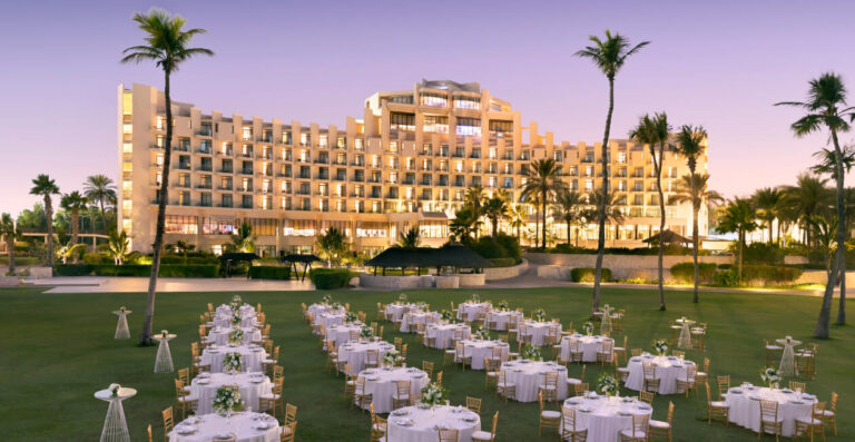 Palmito Garden at dusk with banquet tables in rows, Jebel Ali Golf Resort