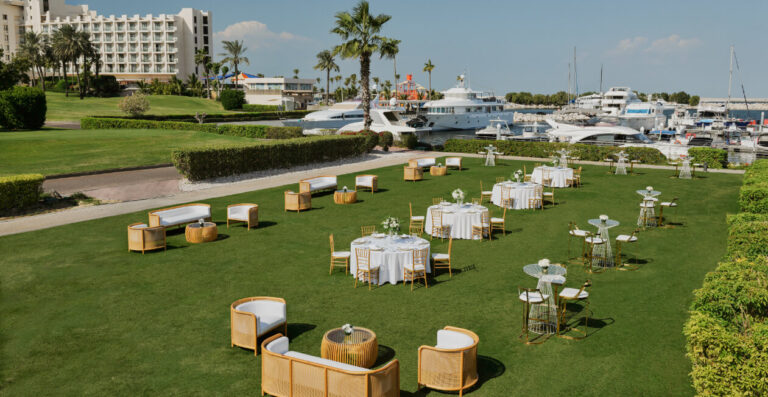 The Croquet Lawn with lounge seating beside the marina, Jebel Ali Golf Resort