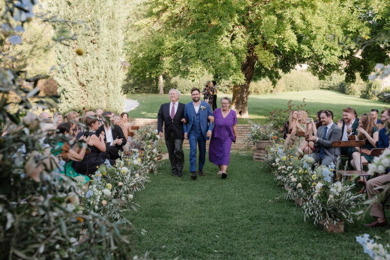 The ceremony aisle at Tenuta Santi Giacomo e Filippo, Urbino, edged with olive branches and wild flowers, Joy Wedding