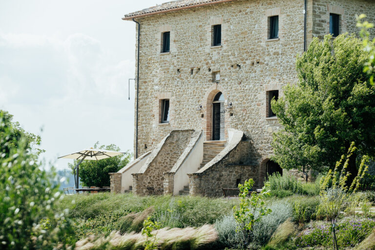 The stone house at Palazzo Serre, San Leo, with its planted garden, Joy Wedding