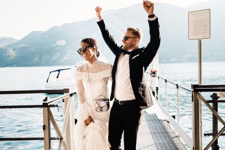 A couple celebrating on a lakeside pier, Julia Event