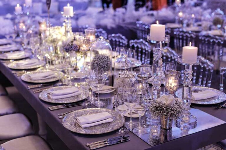 A reception table laid with crystal and candles, Julia Event