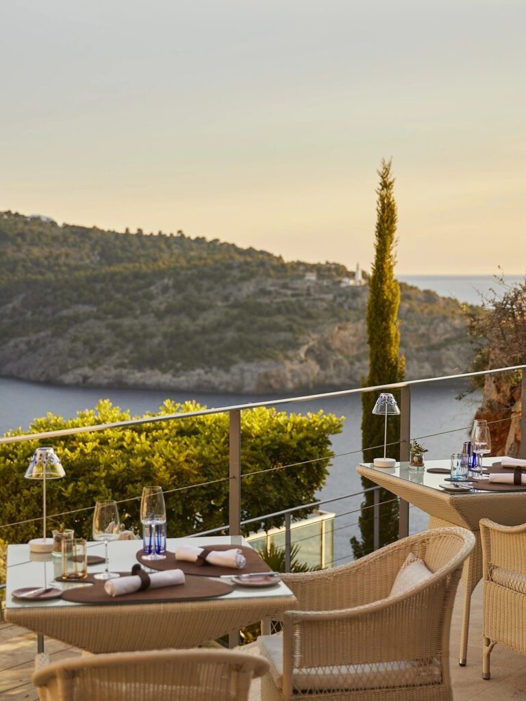 The Es Fanals terrace, cypress trees and the cove beyond, Jumeirah Port Soller Hotel & Spa