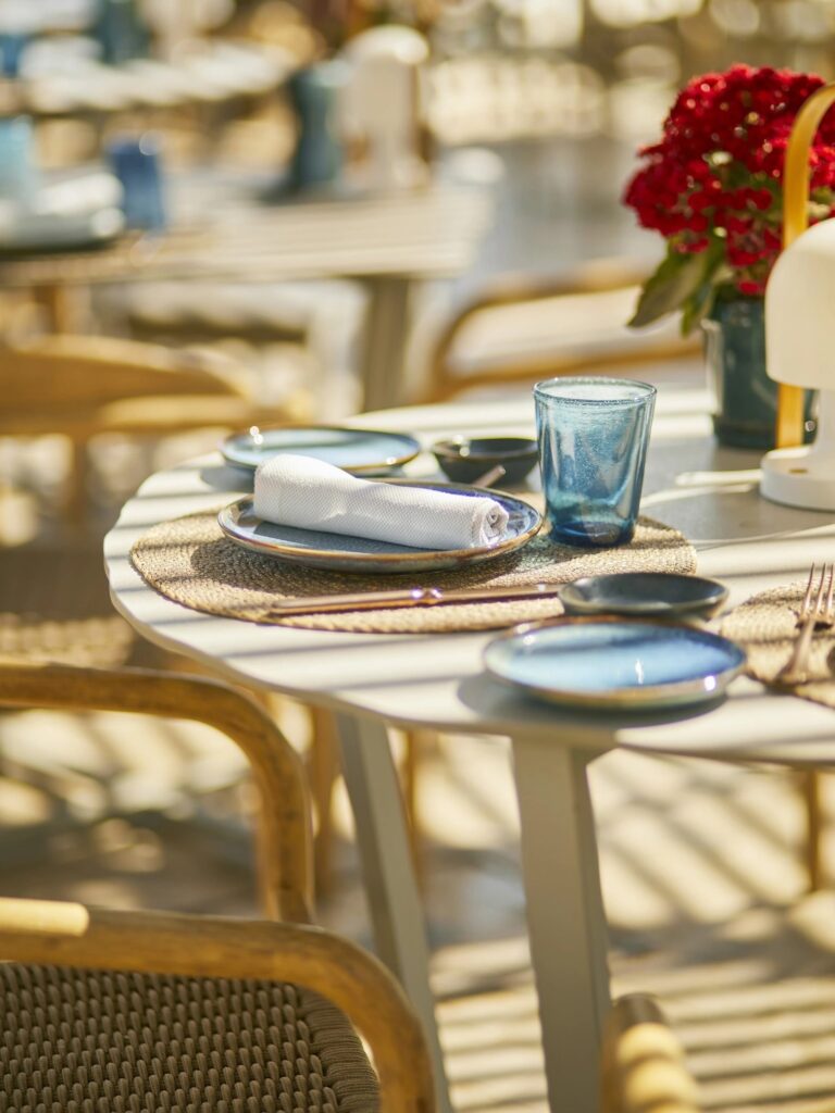 A place setting in blue and gold, close up on the terrace, Jumeirah Port Soller Hotel & Spa