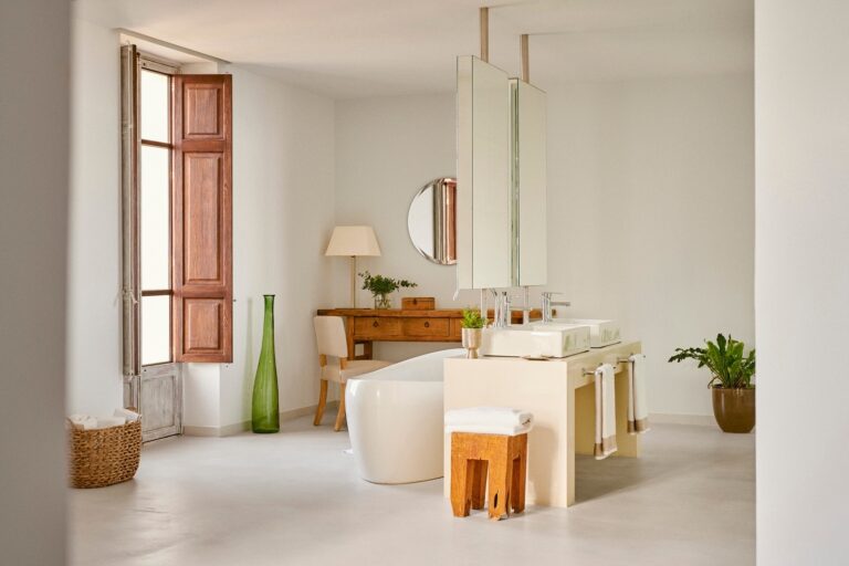 A suite bathroom in warm marble with a freestanding tub, Jumeirah Port Soller Hotel & Spa