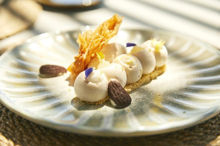 A plated dessert finished with almonds and cream, Jumeirah Port Soller Hotel & Spa