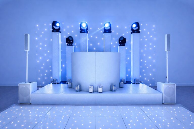 White boxed DJ stage with moving heads and a starlit dance floor, Just Smile Ltd