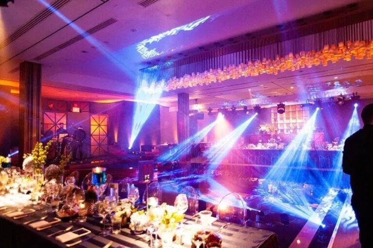 Moving head beams over reception tables in a hotel ballroom, Just Smile Ltd
