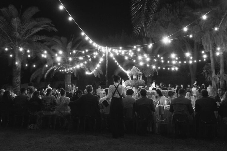 String lights over the tables, in black and white, Kaleidos Wedding