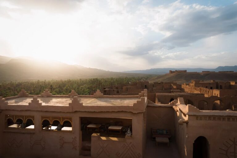 Kasbah terrace above the Draa Valley palm groves in evening light, Kasbah des Caïds