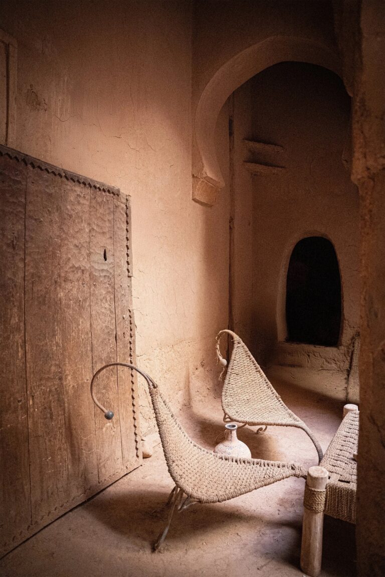 Courtyard corner with two woven chairs, Kasbah des Caïds