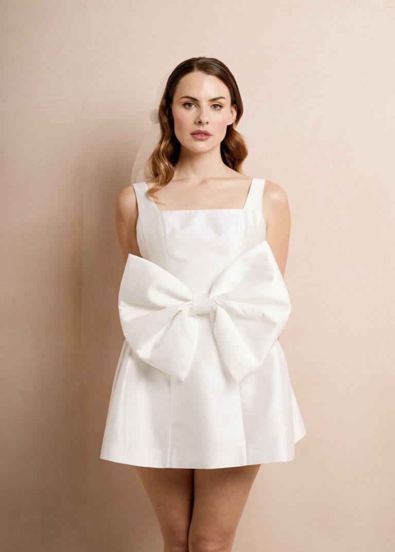 A short square neck dress with an oversized bow, Kate Edmondson Bridal Couture