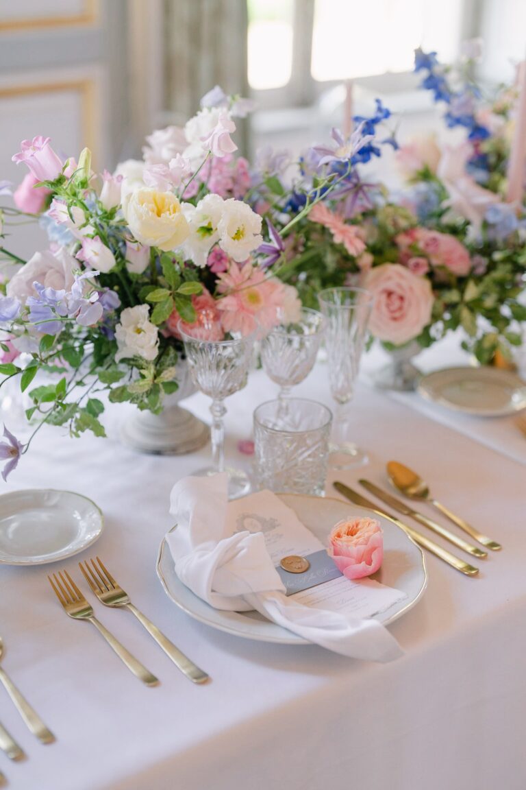 Place setting with a pastel bouquet, candle and folded napkin, Katerina Meyvial Wedding & Event Planner
