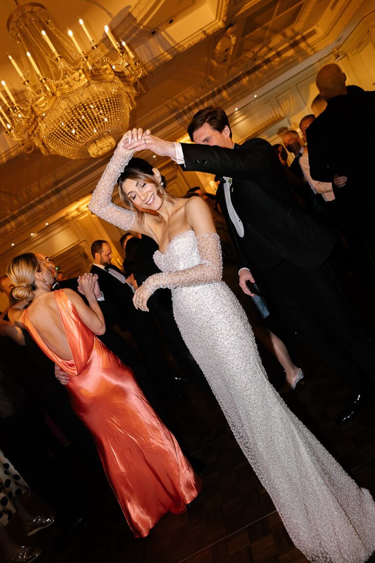 Bride dancing with guests in a gilded room, Shangri-La Paris, Katerina Meyvial Wedding & Event Planner