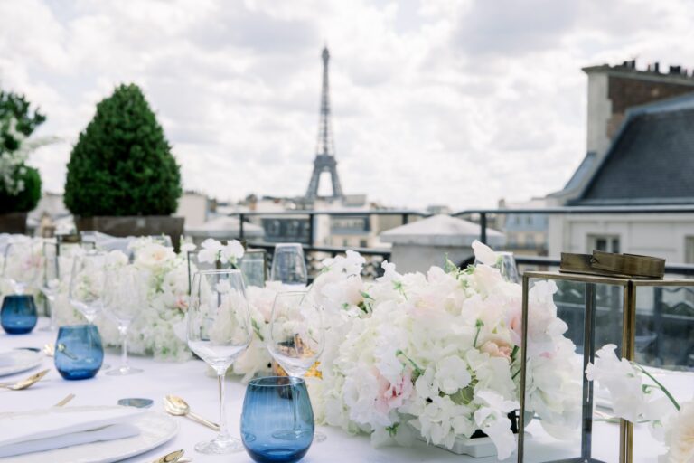 Rooftop table dressed in white flowers and blue glass, Eiffel Tower in the distance, Katerina Meyvial Wedding & Event Planner