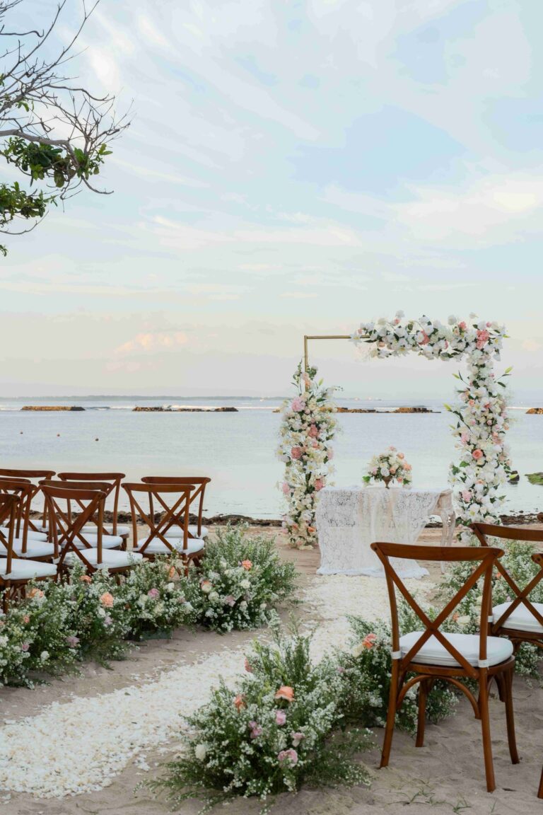 Beach ceremony set with a floral arch, Kayumanis Nusa Dua Private Villa and Spa