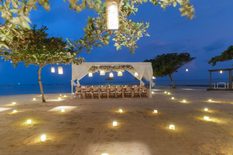 Candlelit beach dinner table at dusk, Kayumanis Nusa Dua Private Villa and Spa