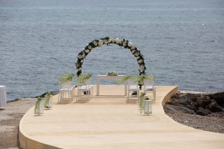 Wedding arch on the Kefalos beach pier, Kefalos Beach Weddings