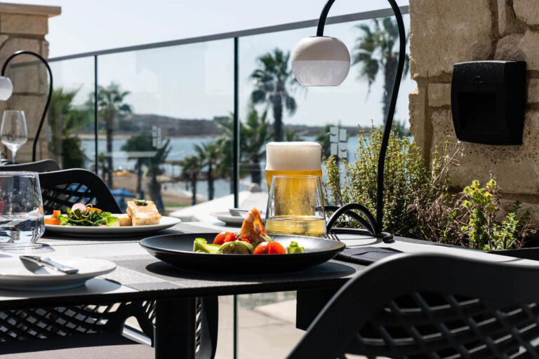 Dining on the terrace overlooking the bay, Kefalos Beach Weddings