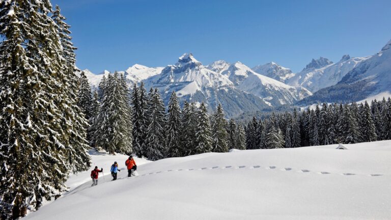 Snowshoe walkers in the mountains above Engelberg, Kempinski Palace Engelberg