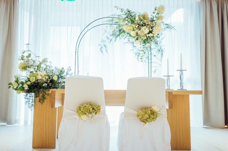 Ceremony seating with floral arch, Kempinski Palace Engelberg