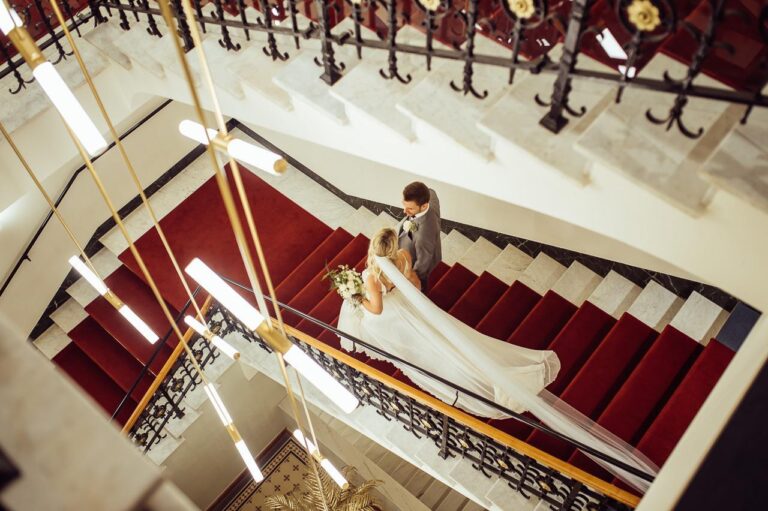 A bride on the grand staircase, Kempinski Palace Engelberg