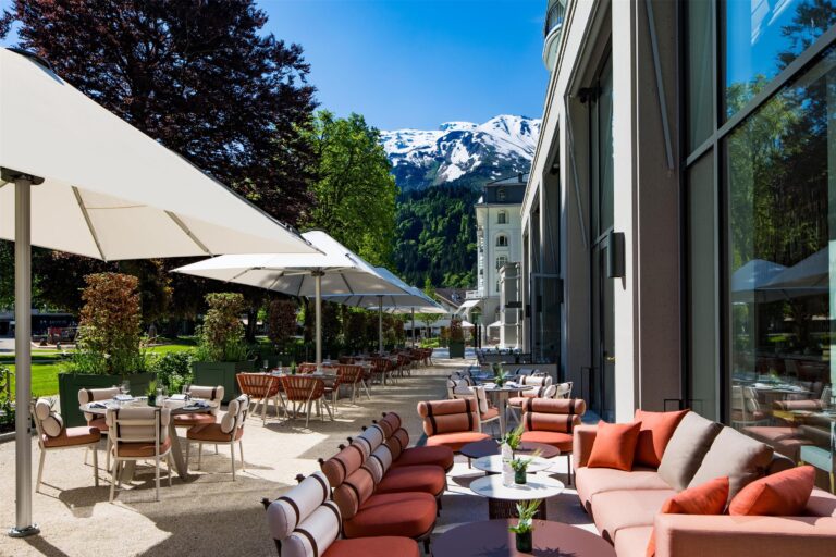 Terrace seating with a view of the mountains, Kempinski Palace Engelberg