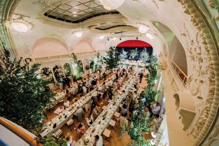 The ballroom set with long banquet tables, Kempinski Palace Engelberg