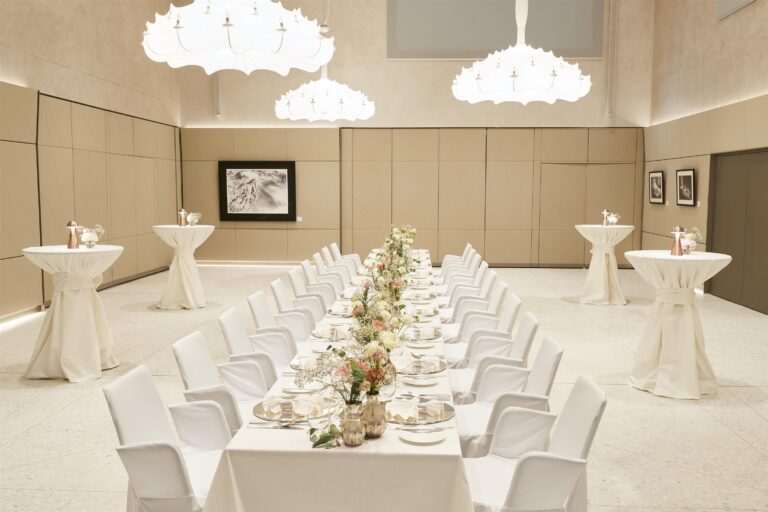 A reception room set for a wedding dinner, Kempinski Palace Engelberg