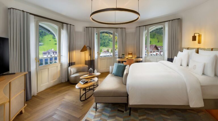 A bedroom with views over Engelberg, Kempinski Palace Engelberg