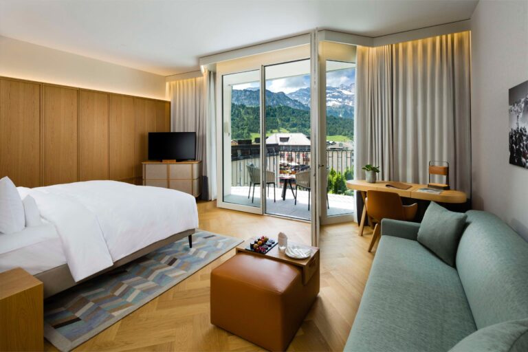A room with a balcony and mountain views, Kempinski Palace Engelberg