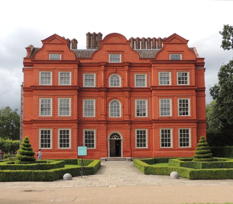 The red-brick facade above its box parterre, the smallest of the royal palaces, Kew Palace