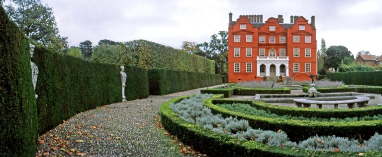 A panorama of the Queen's Garden, its box-edged parterre and central fountain, the palace beyond, Kew Palace