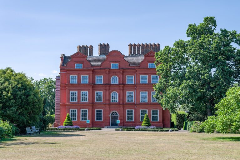 The palace facade on a bright approach through the gardens, Kew Palace