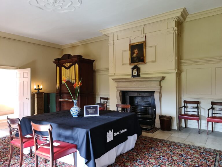 The King's Dining Room dressed for a private dinner, orange blooms on a linen-draped table, Kew Palace