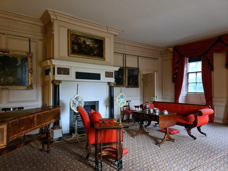 The Queen's Drawing Room, a red sofa and armchairs drawn up to the chimneypiece, Kew Palace