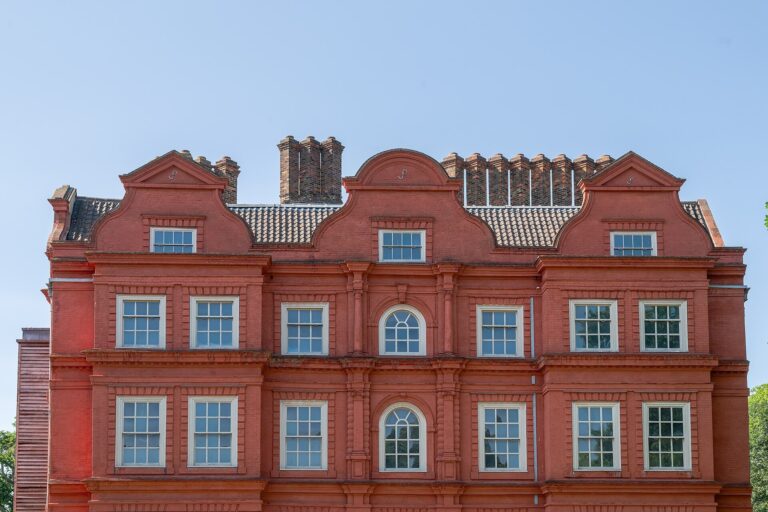 The Dutch-gabled roofline and carved red brickwork of the seventeenth-century house, Kew Palace