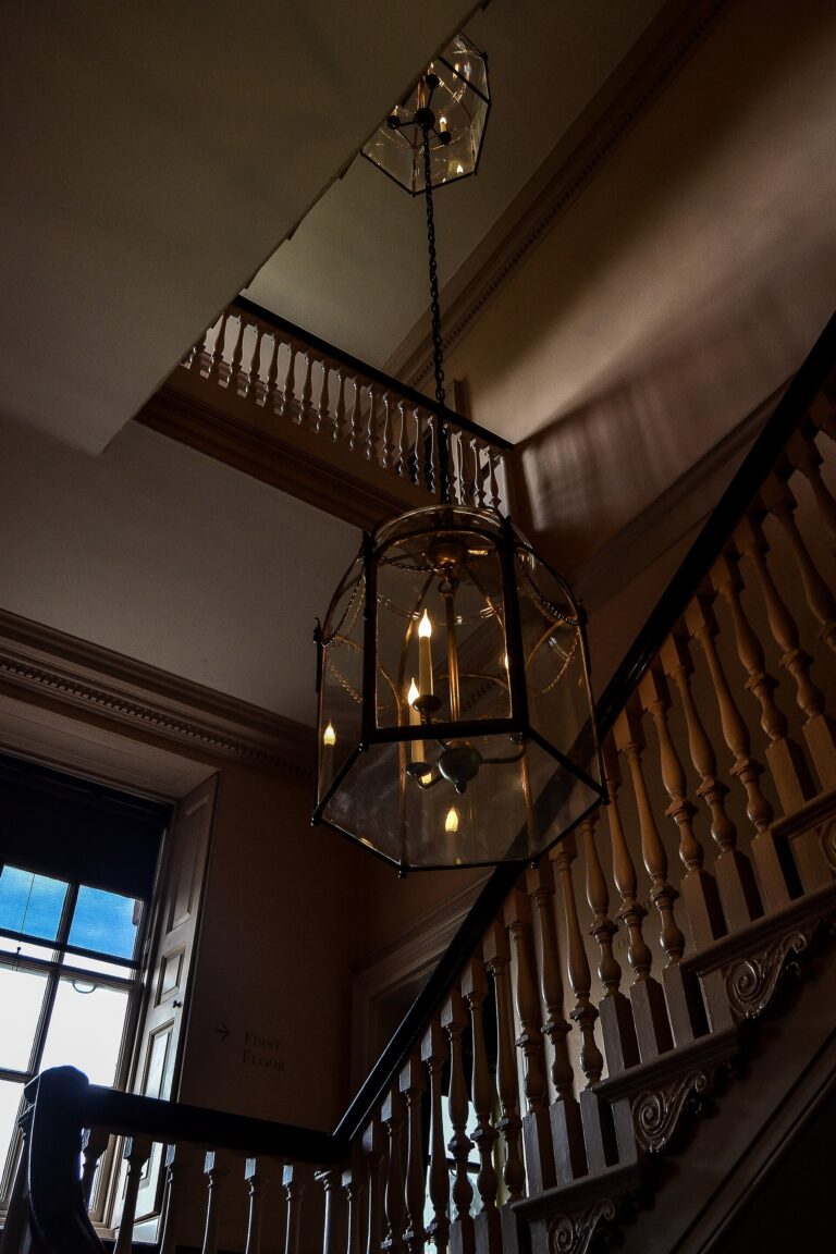 The principal staircase beneath a hanging glass lantern, Kew Palace