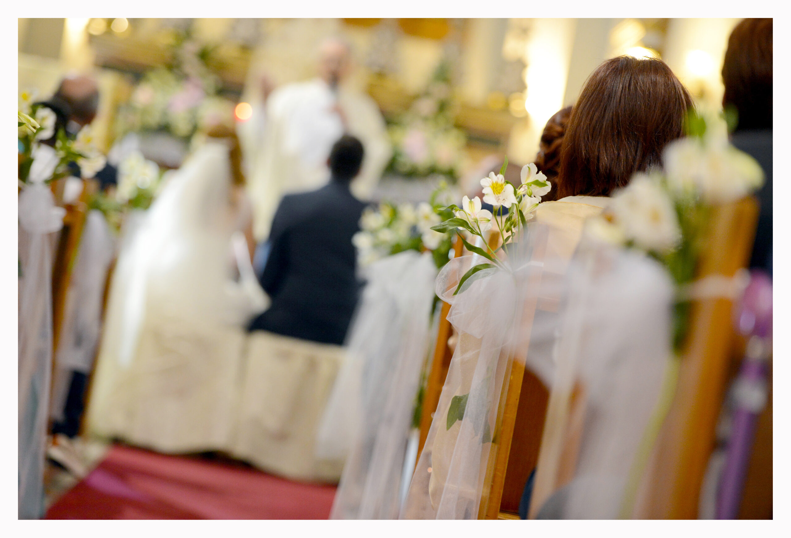 Church ceremony with pew ends dressed in flowers and ribbon, KG Events Malta