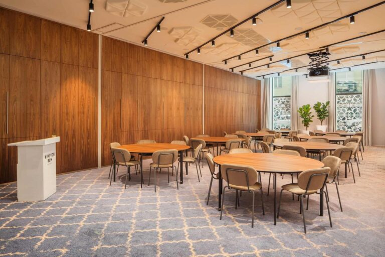 Event room laid with round tables, Kimpton BEM Budapest