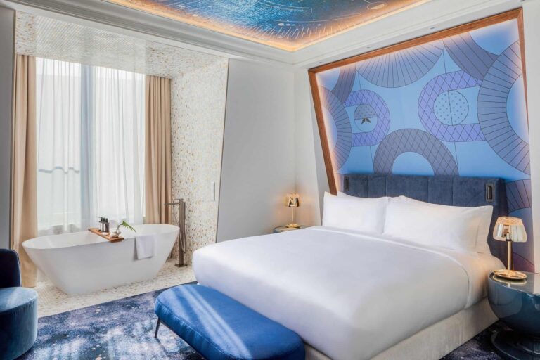Suite with freestanding tub at the foot of the bed, Kimpton BEM Budapest